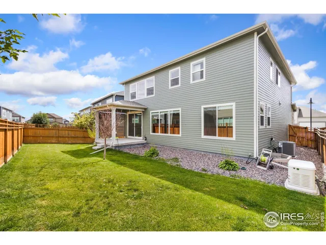 a front view of house with yard and outdoor seating