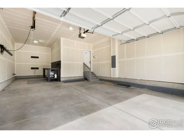 a view of a utility room with cabinets