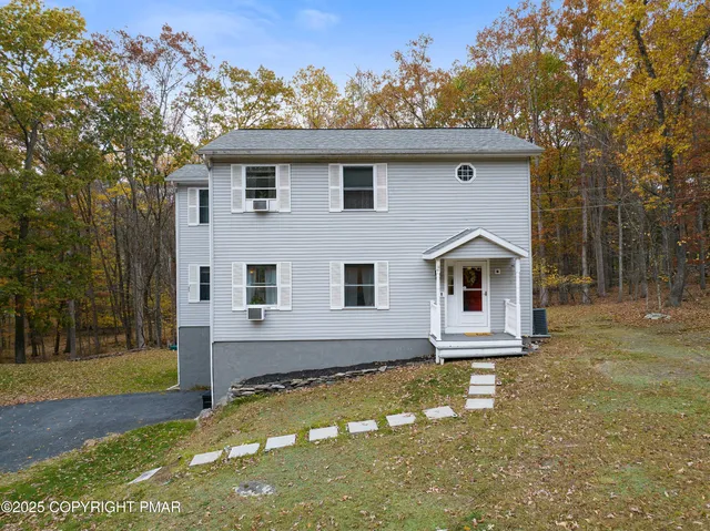 a house with trees in the background