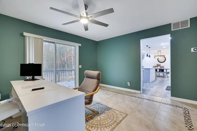 a workspace with furniture and window