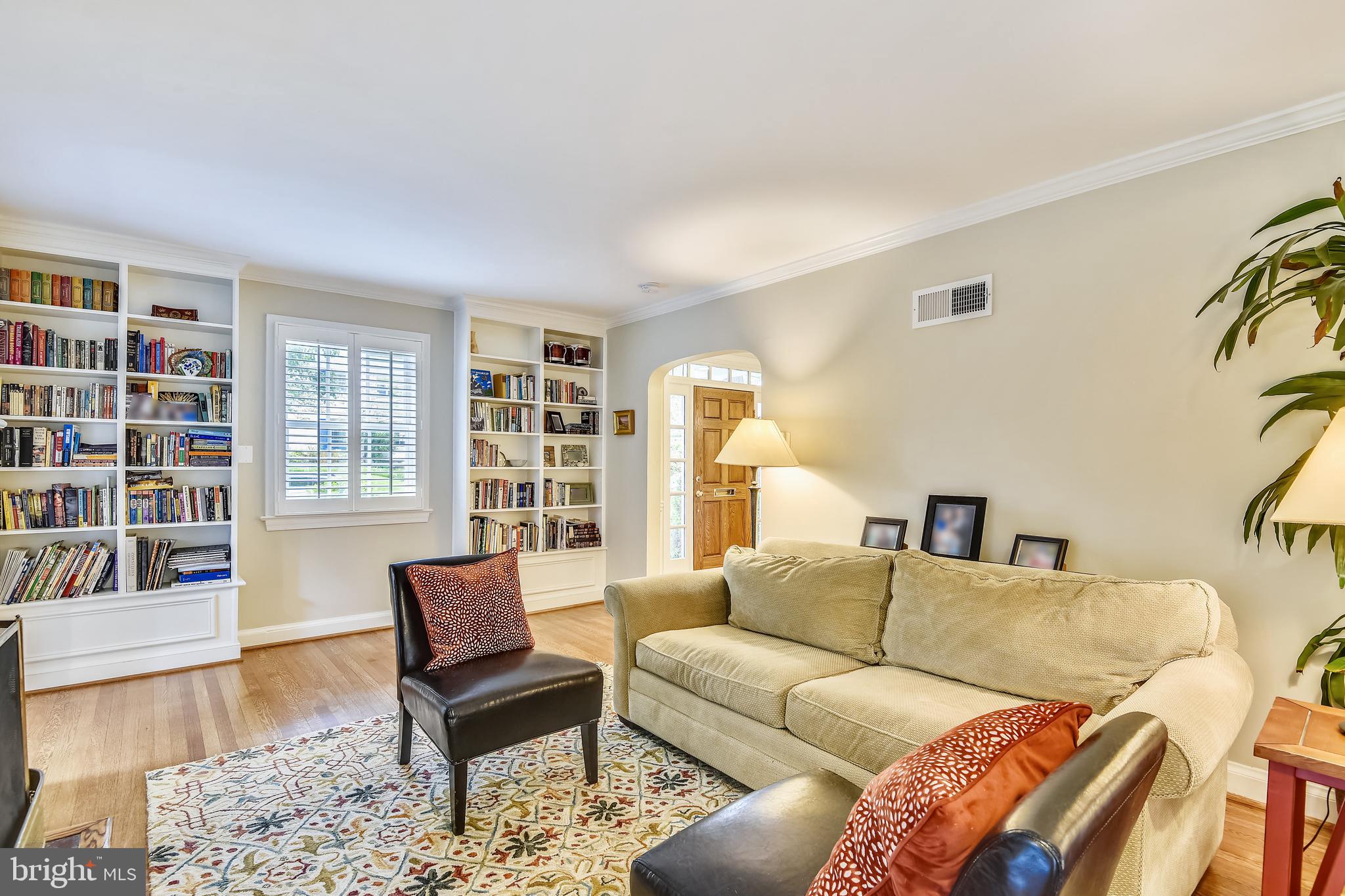 5609 Harwick Road Bethesda, MD 20816 - Photo 17 of 48 Living room with built-in bookshelves