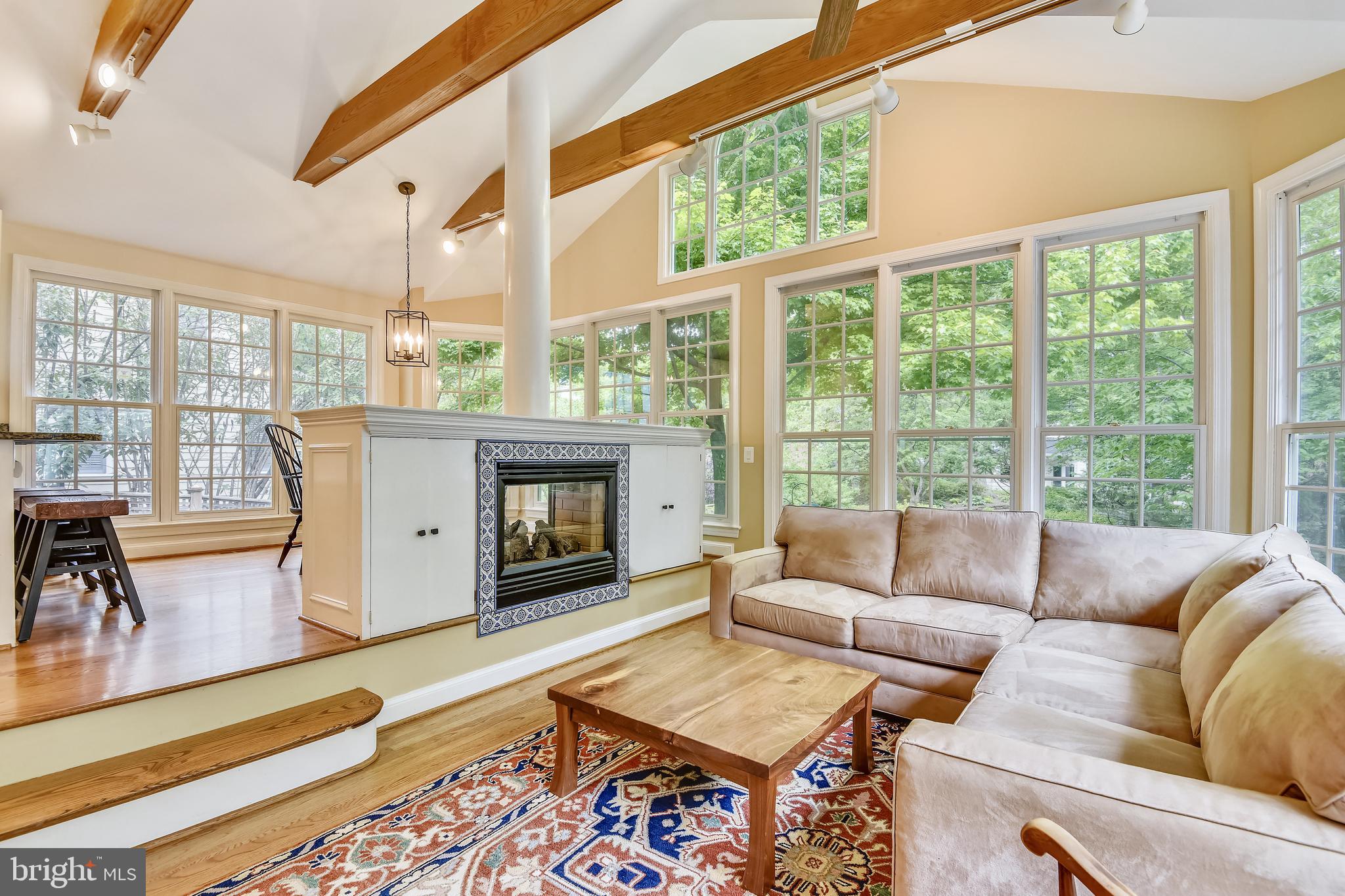 5609 Harwick Road Bethesda, MD 20816 - Photo 6 of 48 Family room has double sided gas fireplace