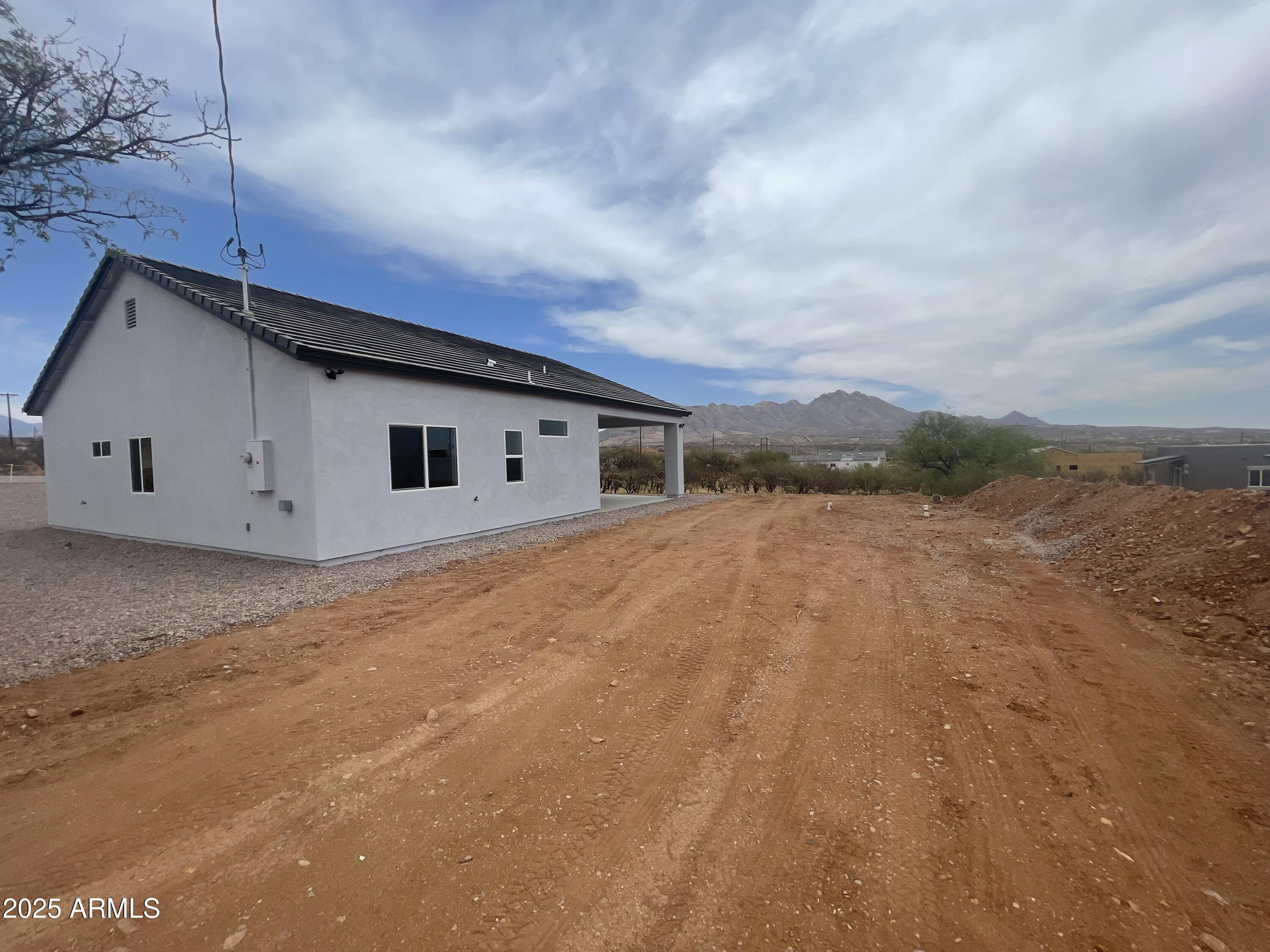 1825 Via Nueva Zelandia Rio Rico, AZ 85648 - Photo 20 of 20 a view of house with backyard and wooden fence