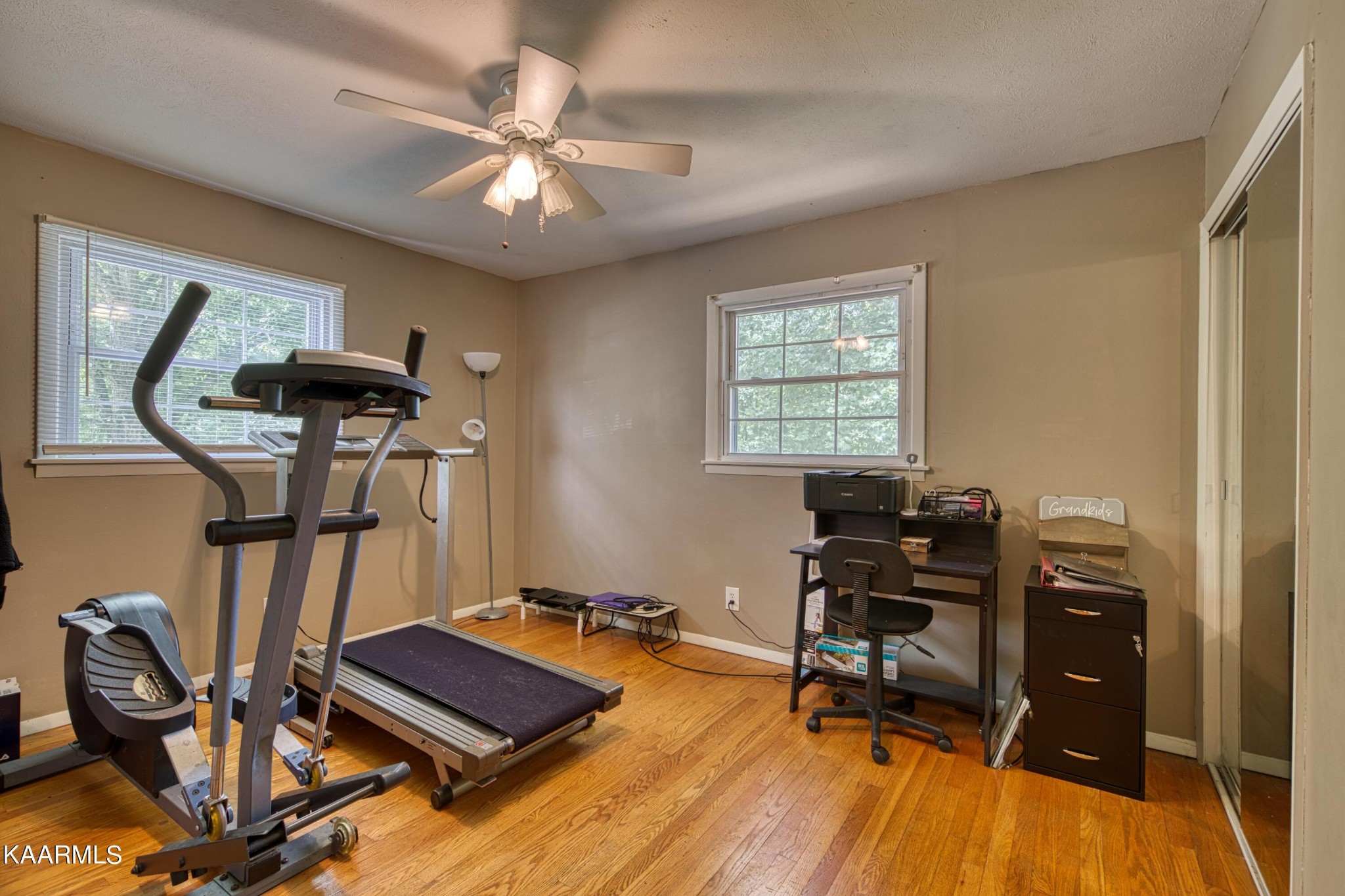 4513 Crestfield Road Knoxville, TN 37921 - Photo 17 of 33 a room with gym equipment and wooden floor