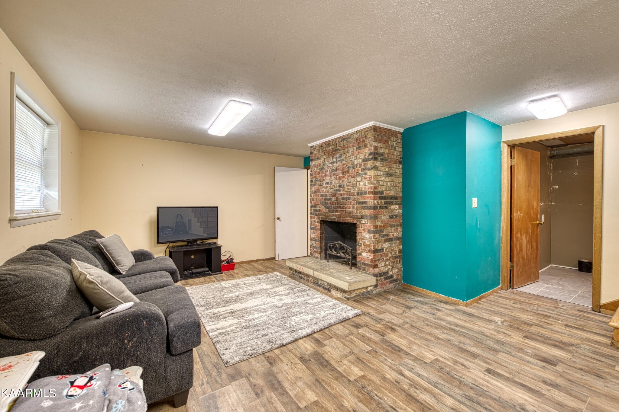 4513 Crestfield Road Knoxville, TN 37921 - Photo 20 of 33 a bedroom with furniture and a fireplace