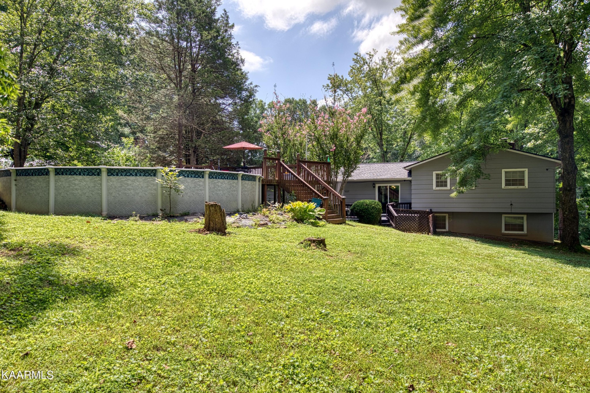 4513 Crestfield Road Knoxville, TN 37921 - Photo 28 of 33 a swimming pool with outdoor seating and yard