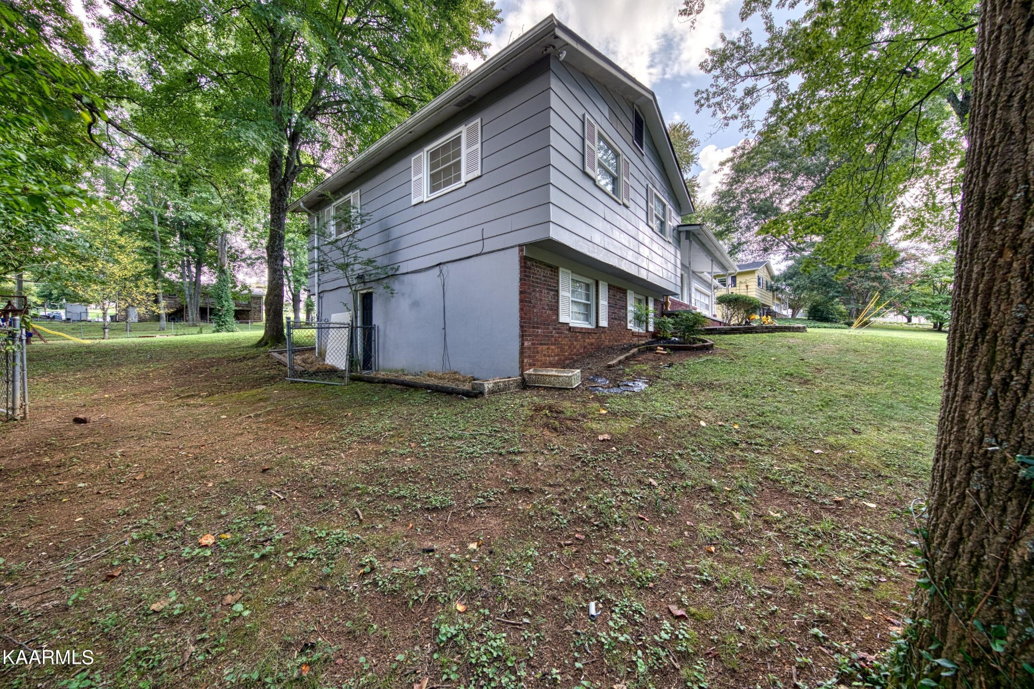 4513 Crestfield Road Knoxville, TN 37921 - Photo 30 of 33 a view of a house with a yard