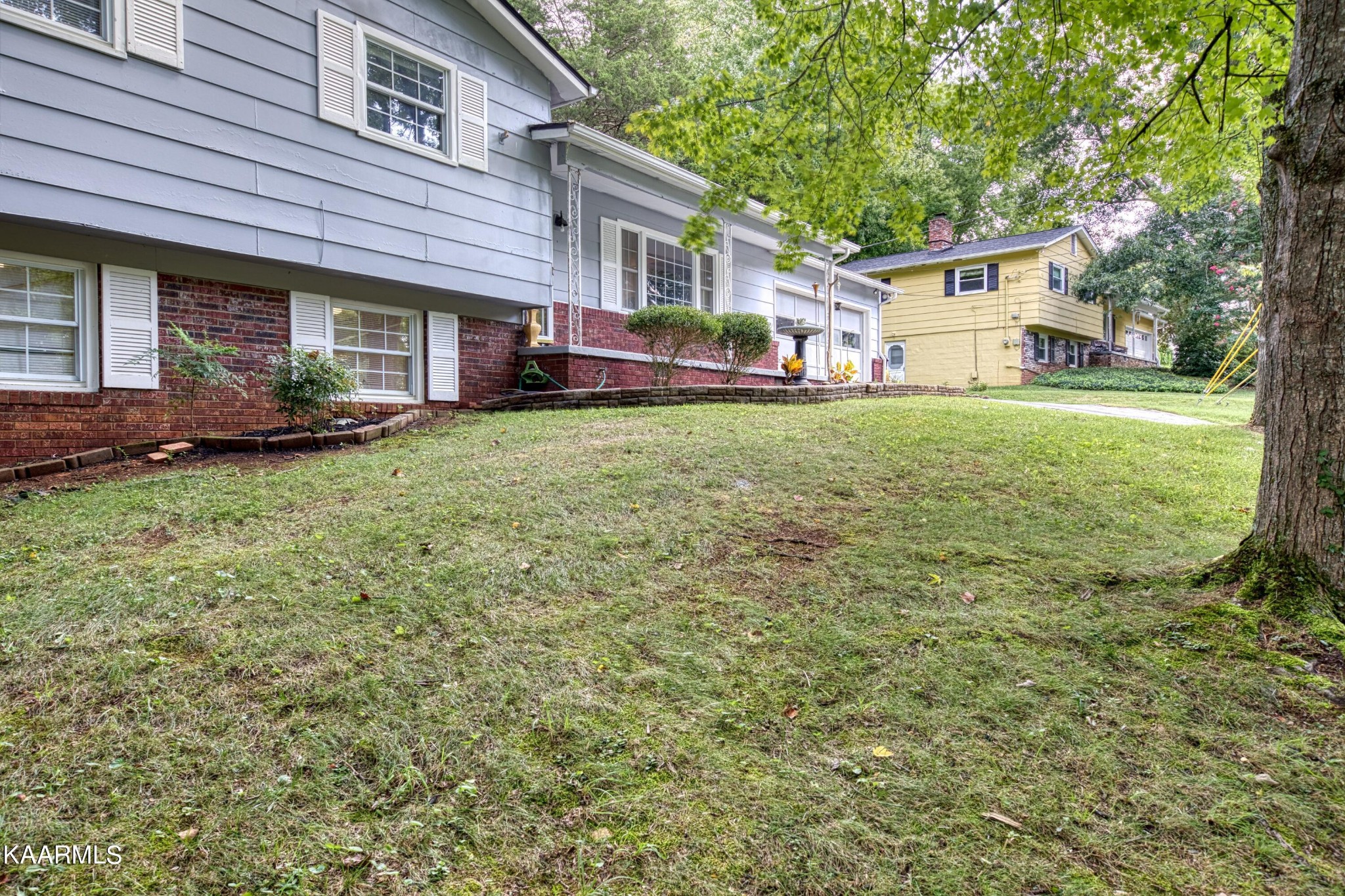 4513 Crestfield Road Knoxville, TN 37921 - Photo 3 of 33 a front view of a house with a garden