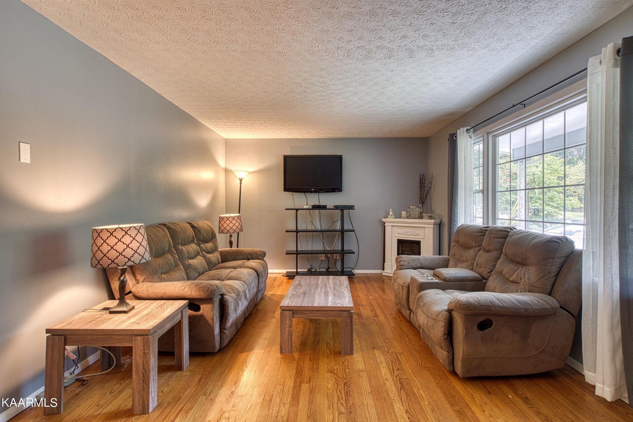 4513 Crestfield Road Knoxville, TN 37921 - Photo 5 of 33 a living room with furniture and a flat screen tv