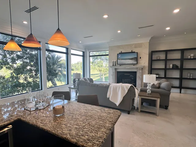 a white bath tub sitting in a bathroom next to a window
