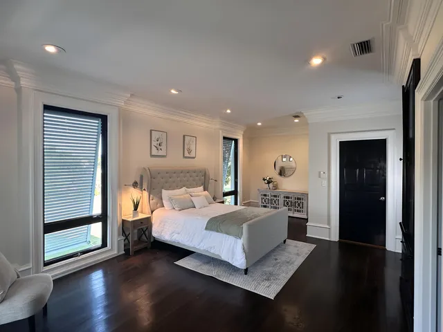 a view of staircase with lots of frames and wooden floor