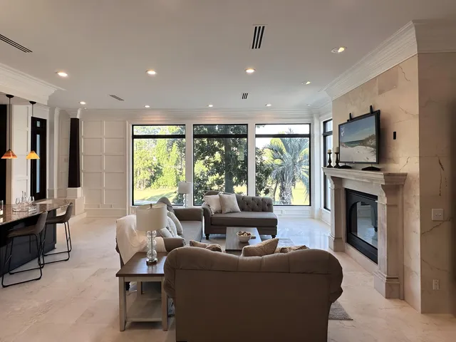 a bedroom with a large bed and wooden floor