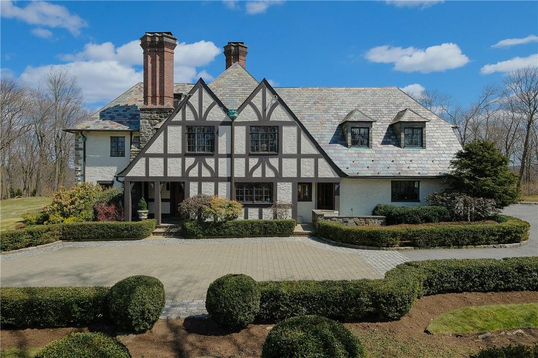 Welcome to 254 Hamilton-true stucco Tudor, 5 bedroom 4.2 baths, with slate roof and courtyard entree minutes from town and train on lush, parlike property with perennial gardens and specimen plantings