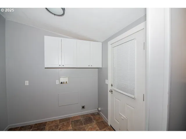 a kitchen with stainless steel appliances granite countertop a refrigerator a stove a sink and a refrigerator