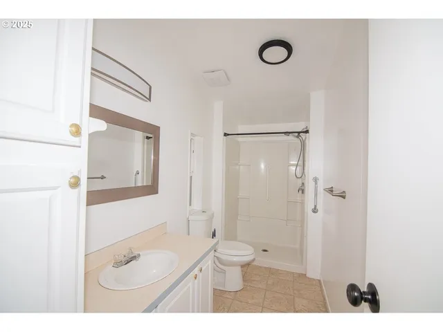 a view of an empty room with windows