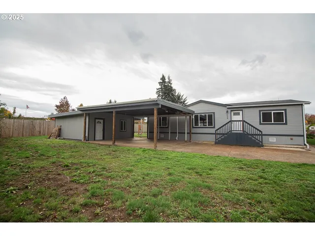 a backyard of a house with lots of green space