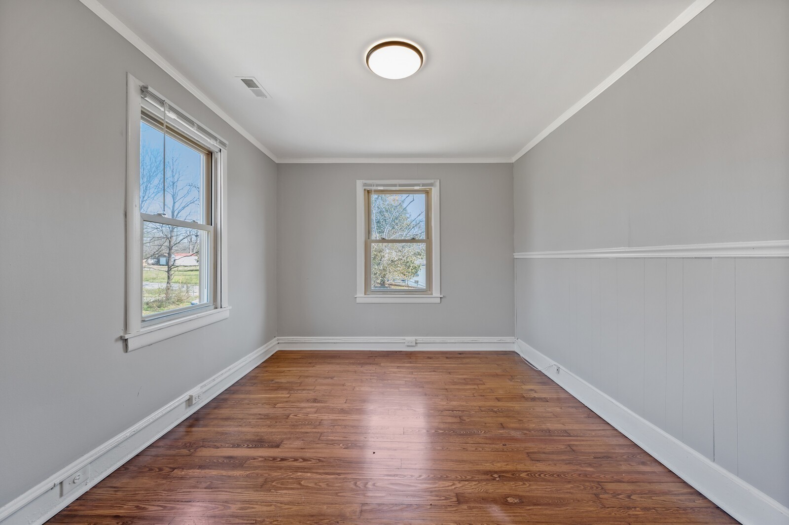 1110 Fowler Street Old Hickory, TN 37138 - Photo 12 of 16 an empty room with wooden floor and windows