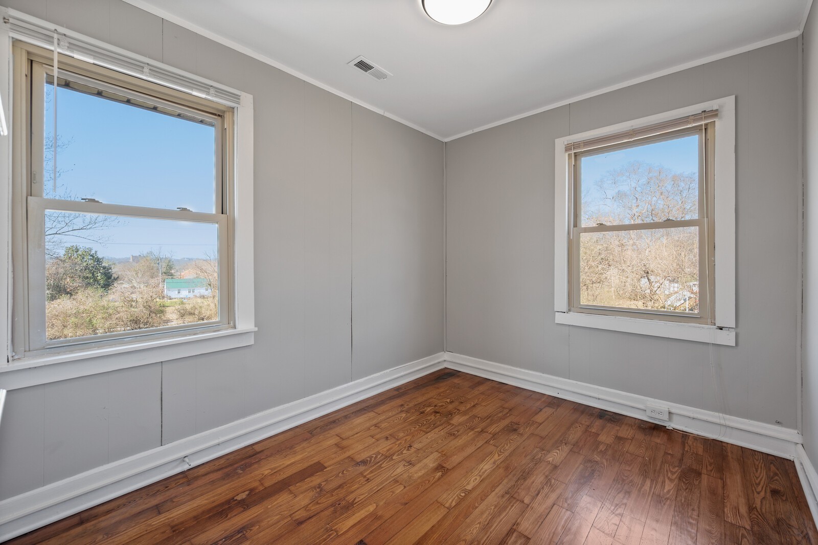 1110 Fowler Street Old Hickory, TN 37138 - Photo 13 of 16 a view of an empty room with wooden floor and a window