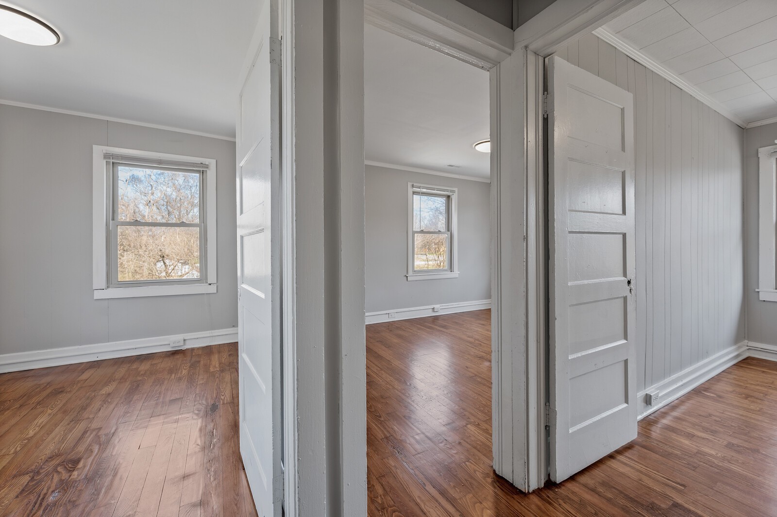 1110 Fowler Street Old Hickory, TN 37138 - Photo 15 of 16 an empty room and wooden floor with windows