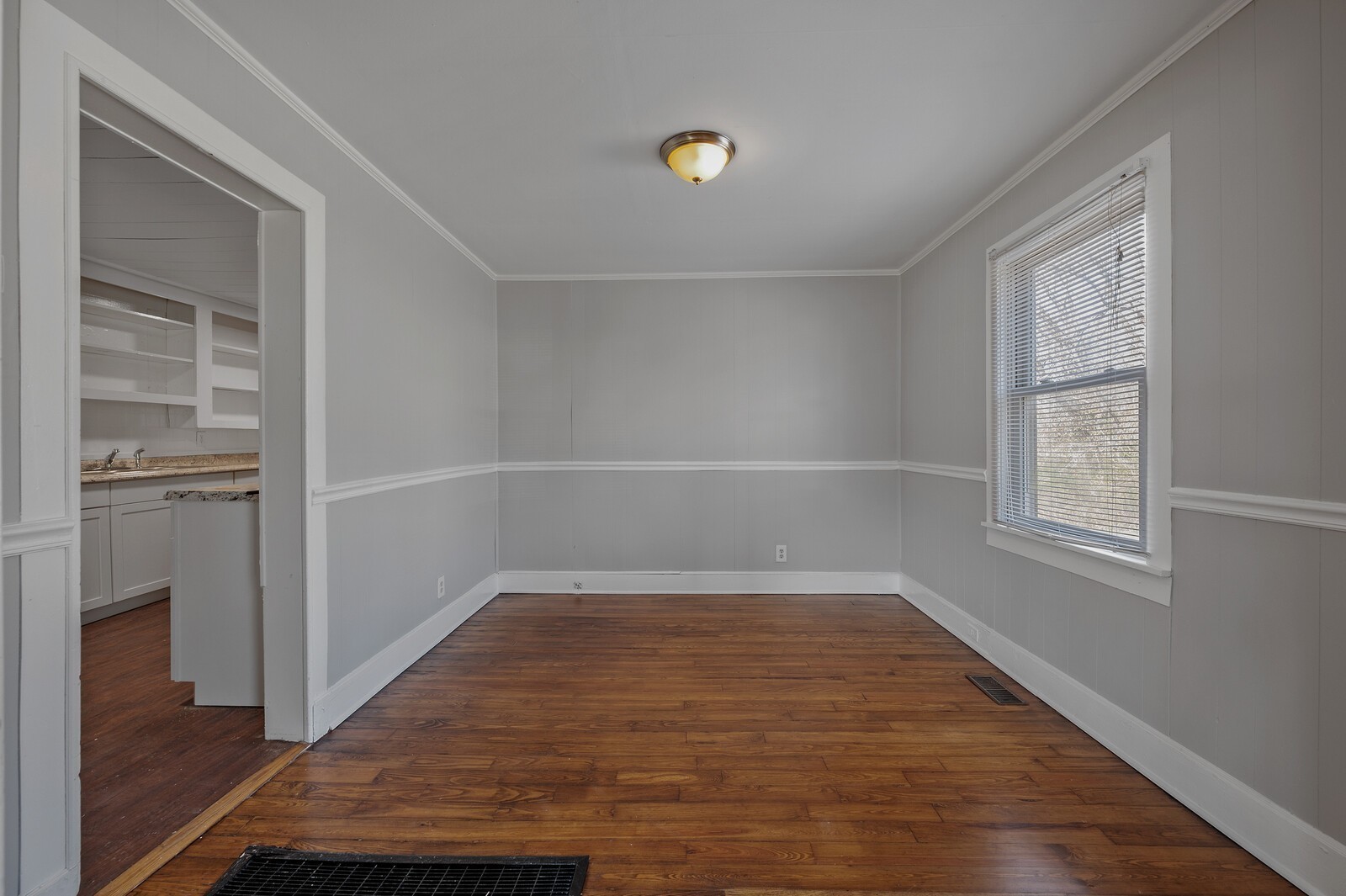1110 Fowler Street Old Hickory, TN 37138 - Photo 4 of 16 wooden floor in an empty room with a window