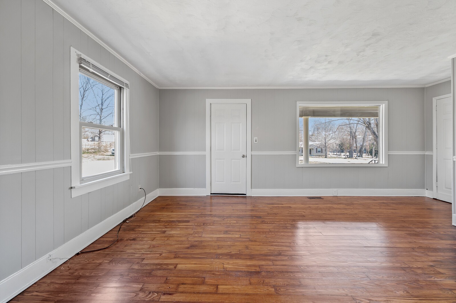 1110 Fowler Street Old Hickory, TN 37138 - Photo 5 of 16 a view of an empty room with wooden floor and a window