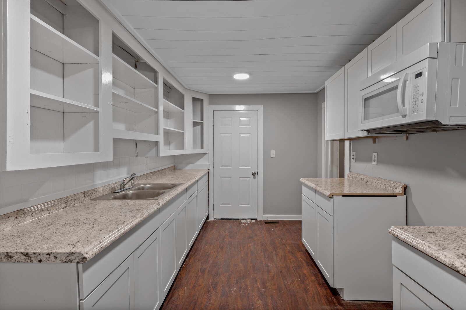 1110 Fowler Street Old Hickory, TN 37138 - Photo 6 of 16 a kitchen with granite countertop a sink and wooden cabinets