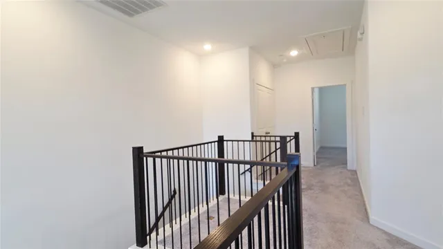 a view of hallway with stairs