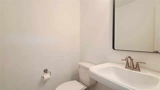 a bathroom with a sink and a toilet