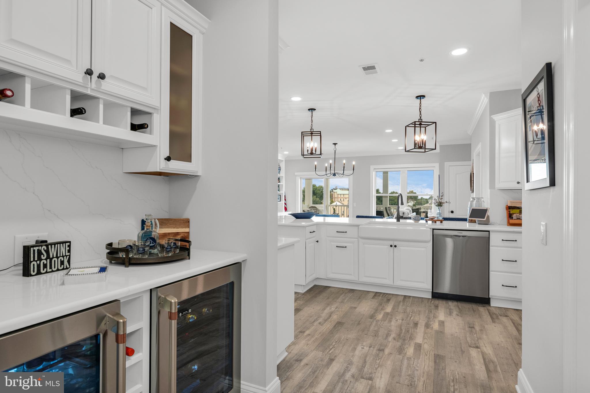 301 Muir Street, Unit 303 Cambridge, MD 21613 - Photo 17 of 36 a kitchen with cabinets and window