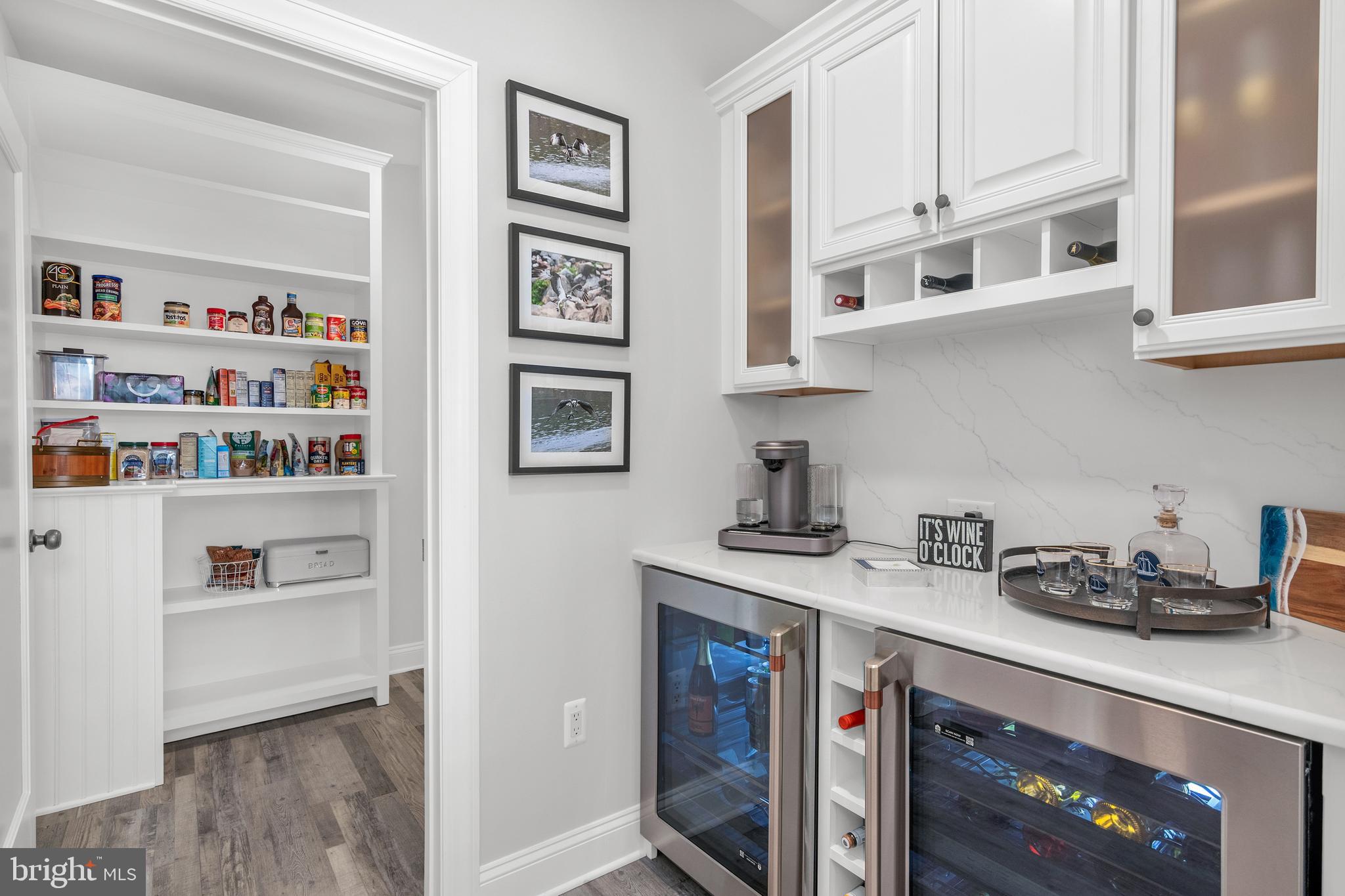 301 Muir Street, Unit 303 Cambridge, MD 21613 - Photo 18 of 36 a kitchen with stainless steel appliances granite countertop a refrigerator and a stove