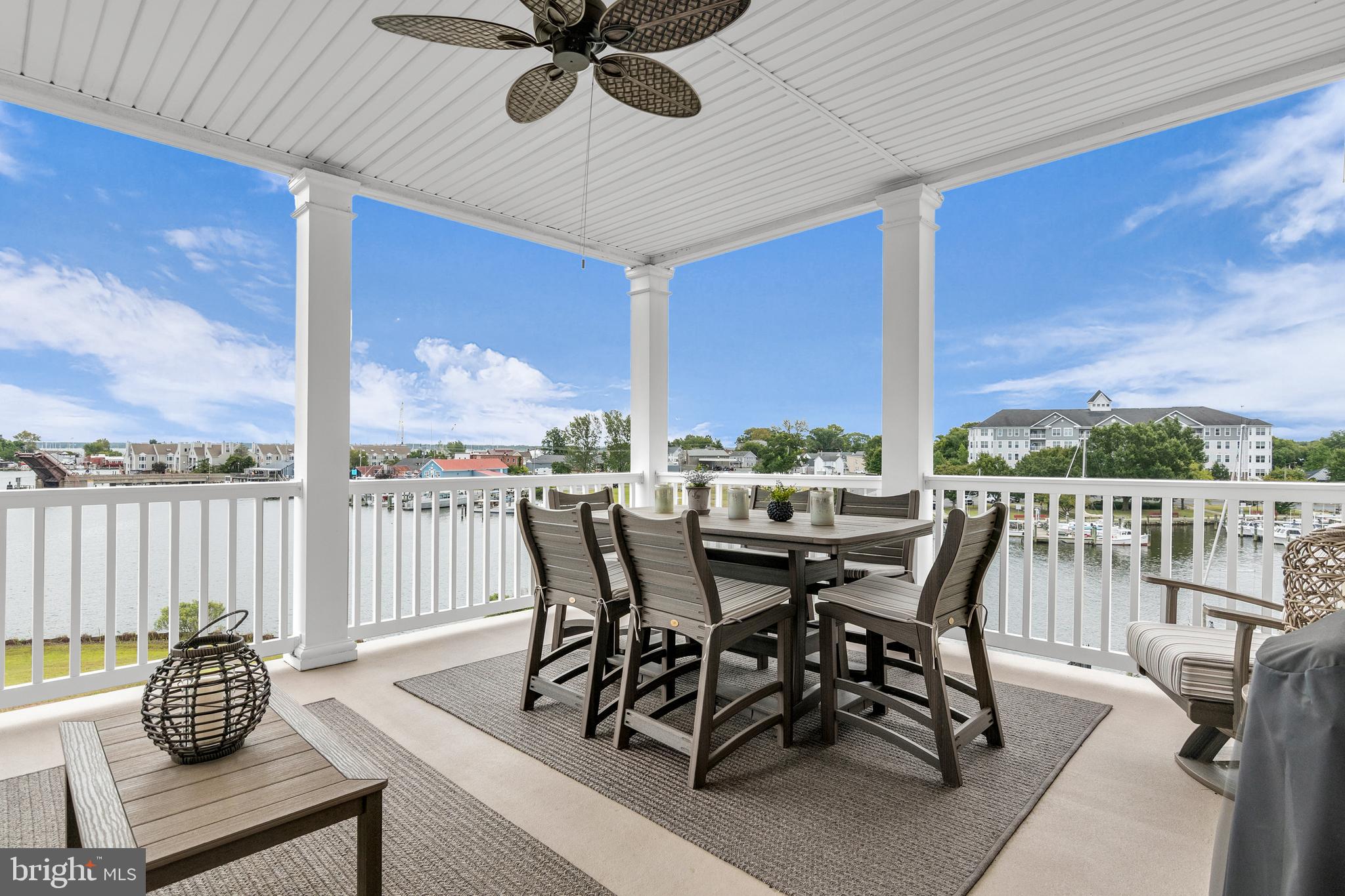 301 Muir Street, Unit 303 Cambridge, MD 21613 - Photo 3 of 36 a view of a dining room with furniture window and outside view