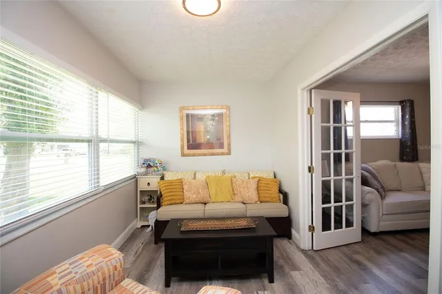 a bedroom with furniture and a window