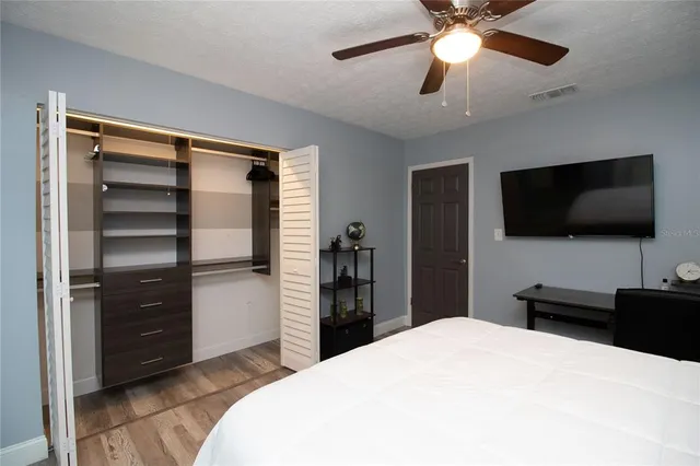 a view of walk in closet with empty racks