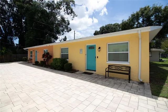 a backyard of a house with seating space