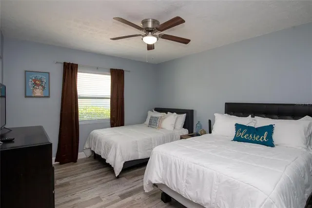 a living room with furniture and flat screen tv