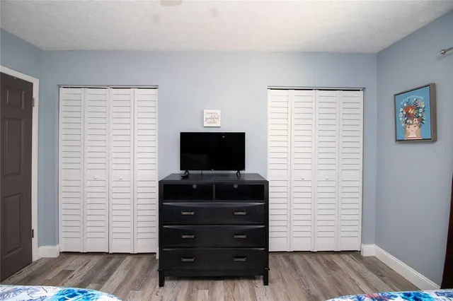 a room with furniture and flat screen tv