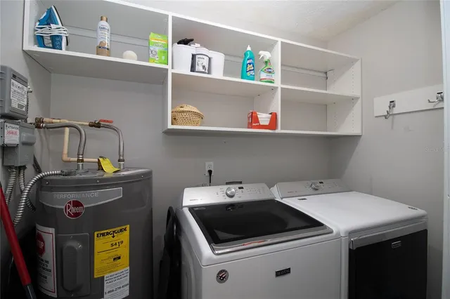 a view of a patio with a table and chairs