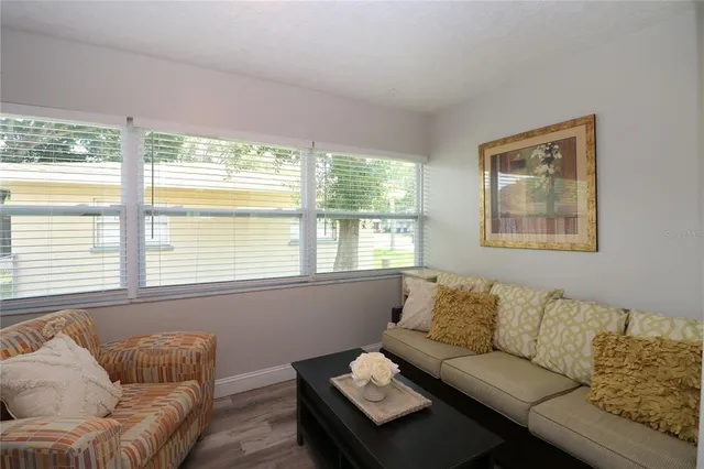 a living room with furniture and a window