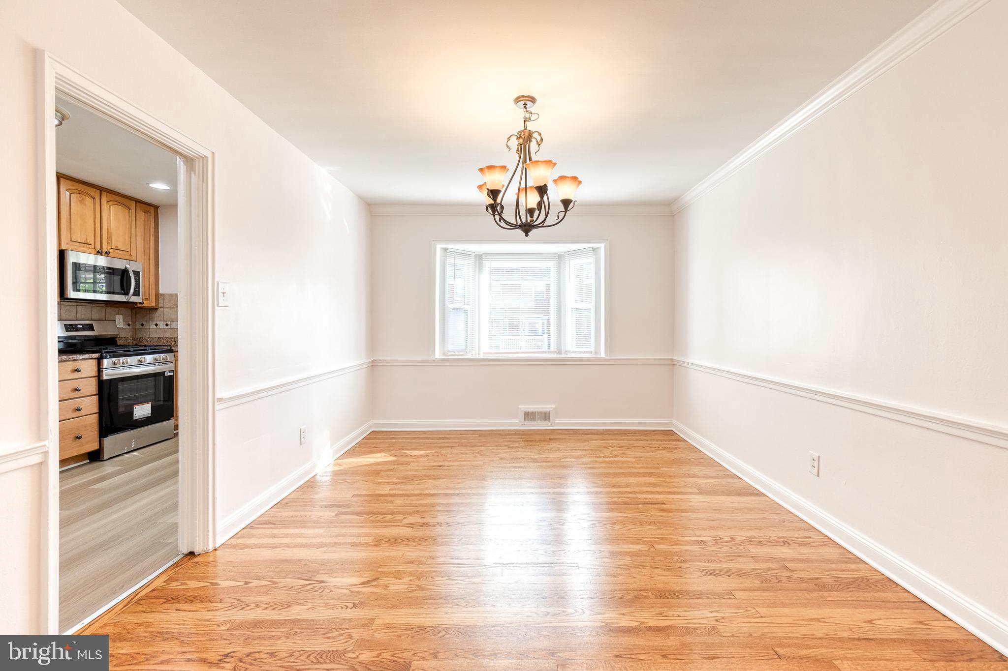2012 Northbourne Road Baltimore, MD 21239 - Photo 12 of 35 a view of a room with wooden flooring and kitchen view