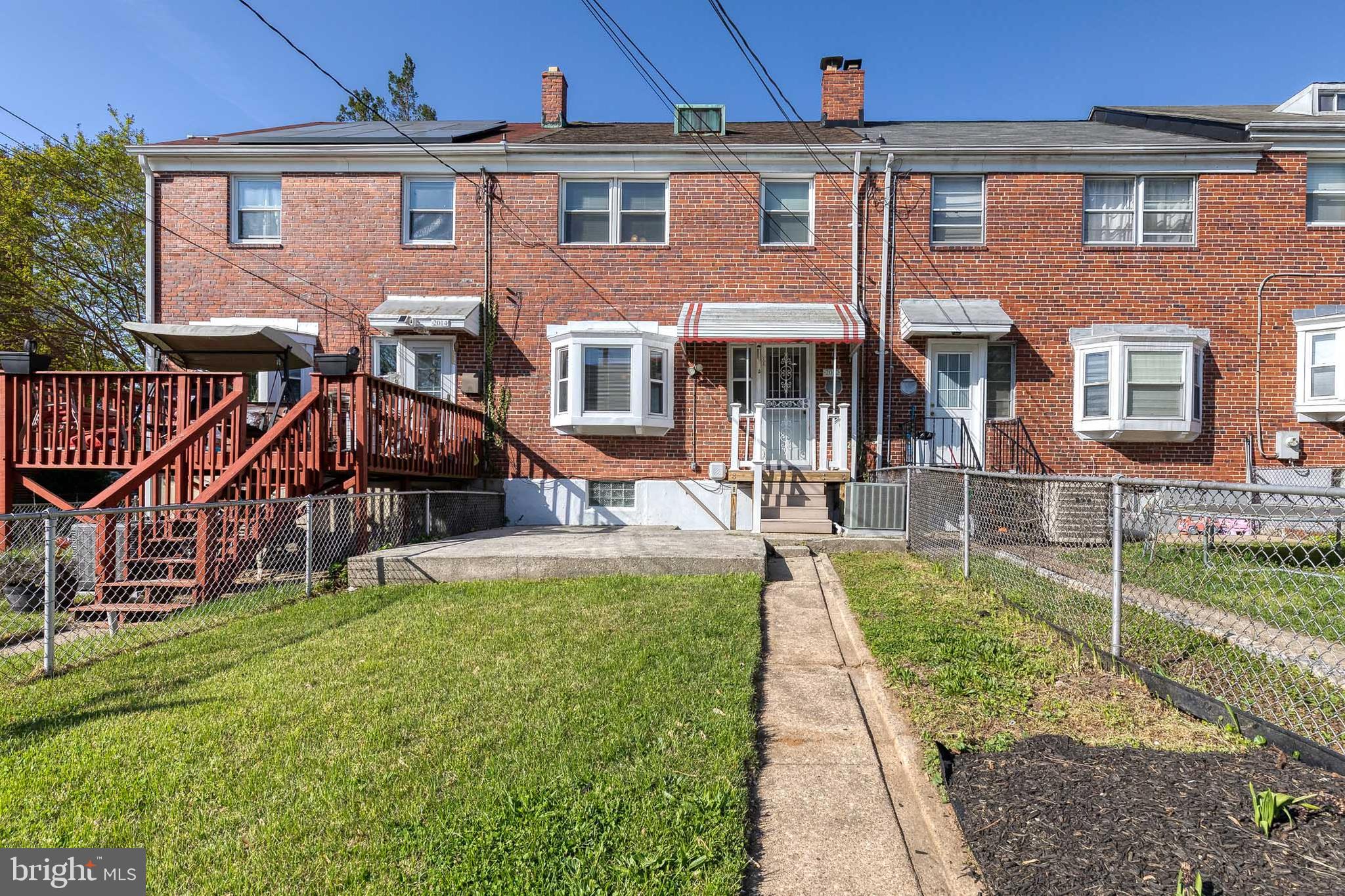 2012 Northbourne Road Baltimore, MD 21239 - Photo 35 of 35 front view of a house with a yard