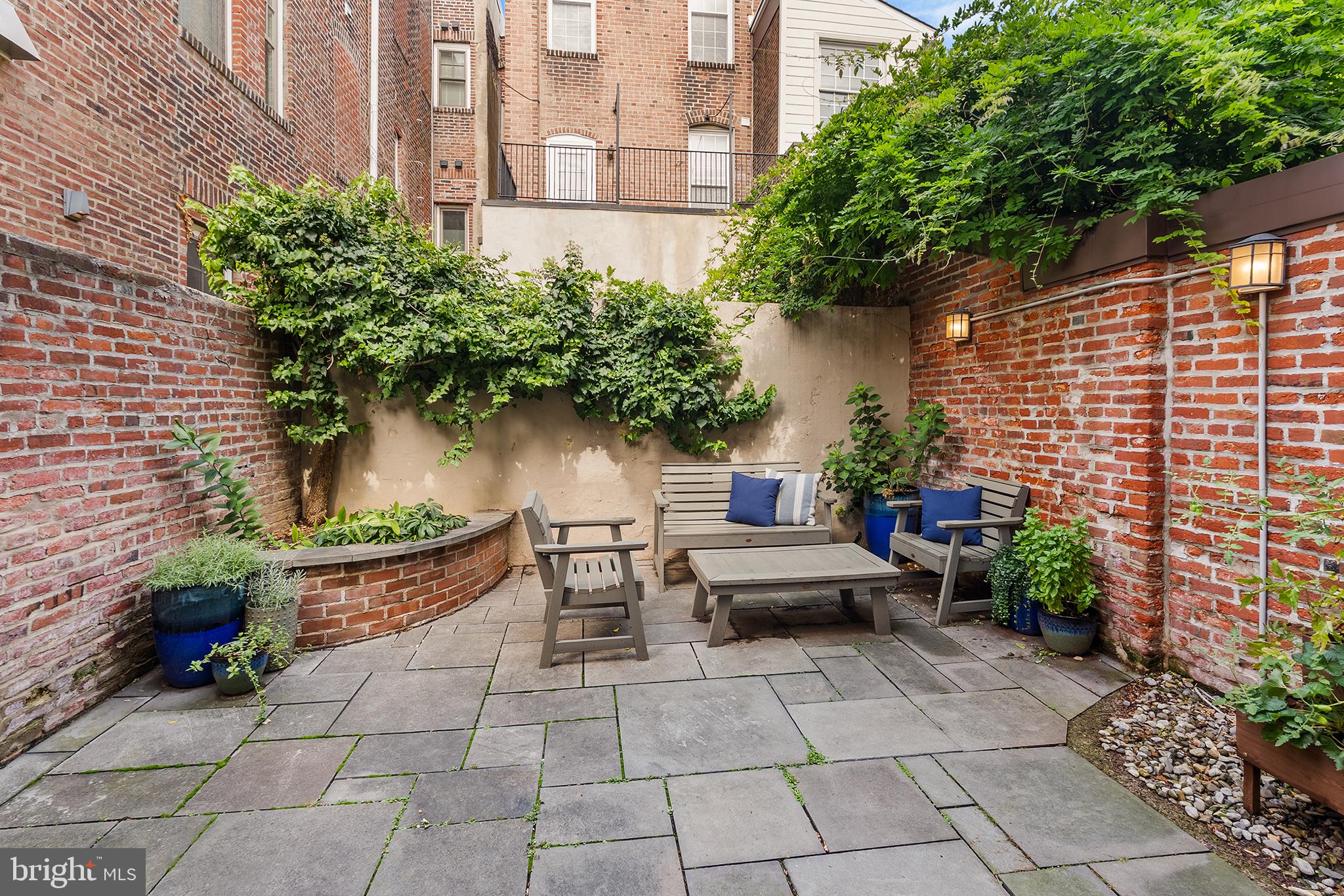631 Addison Street Philadelphia, PA 19147 - Photo 8 of 25 Slate patio with tall brick privacy walls