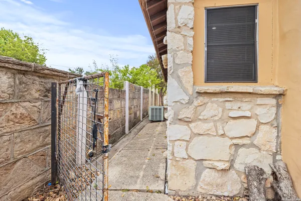 a view of house with a door and wooden door