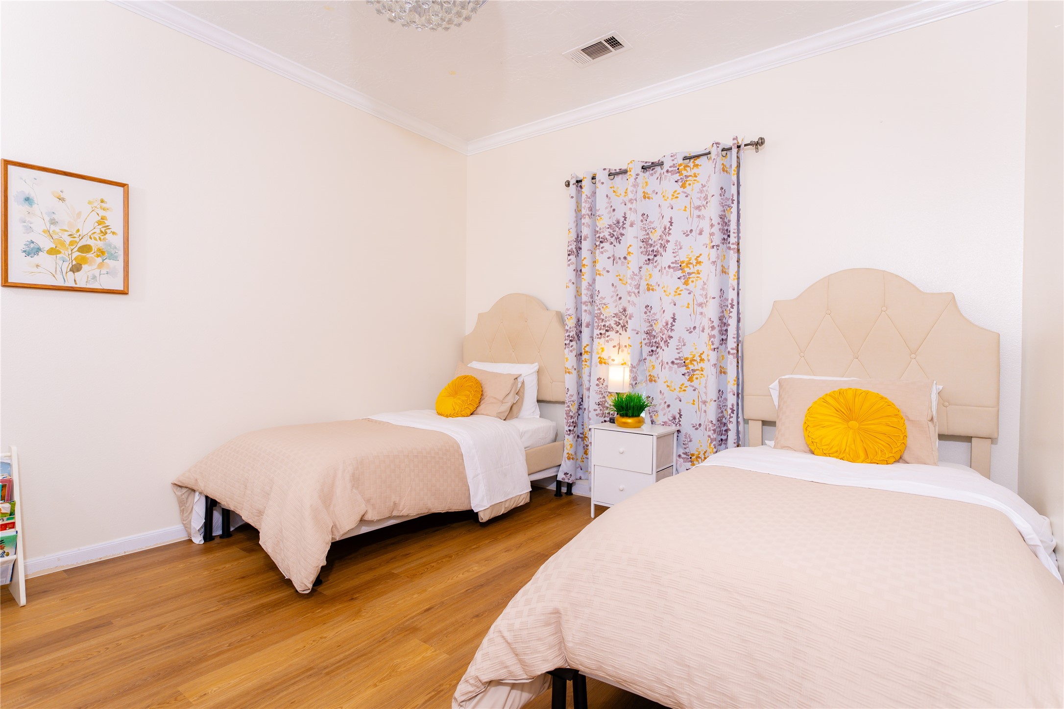 15711 Edo Circle Houston, TX 77083 - Photo 16 of 19 a bed room with a bed and paintings on the wall