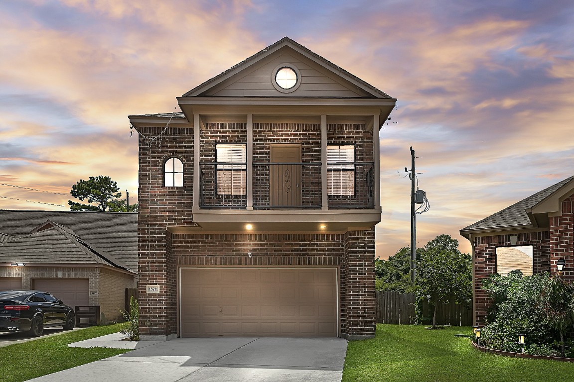 15711 Edo Circle Houston, TX 77083 - Photo 2 of 19 a front view of a house with garden