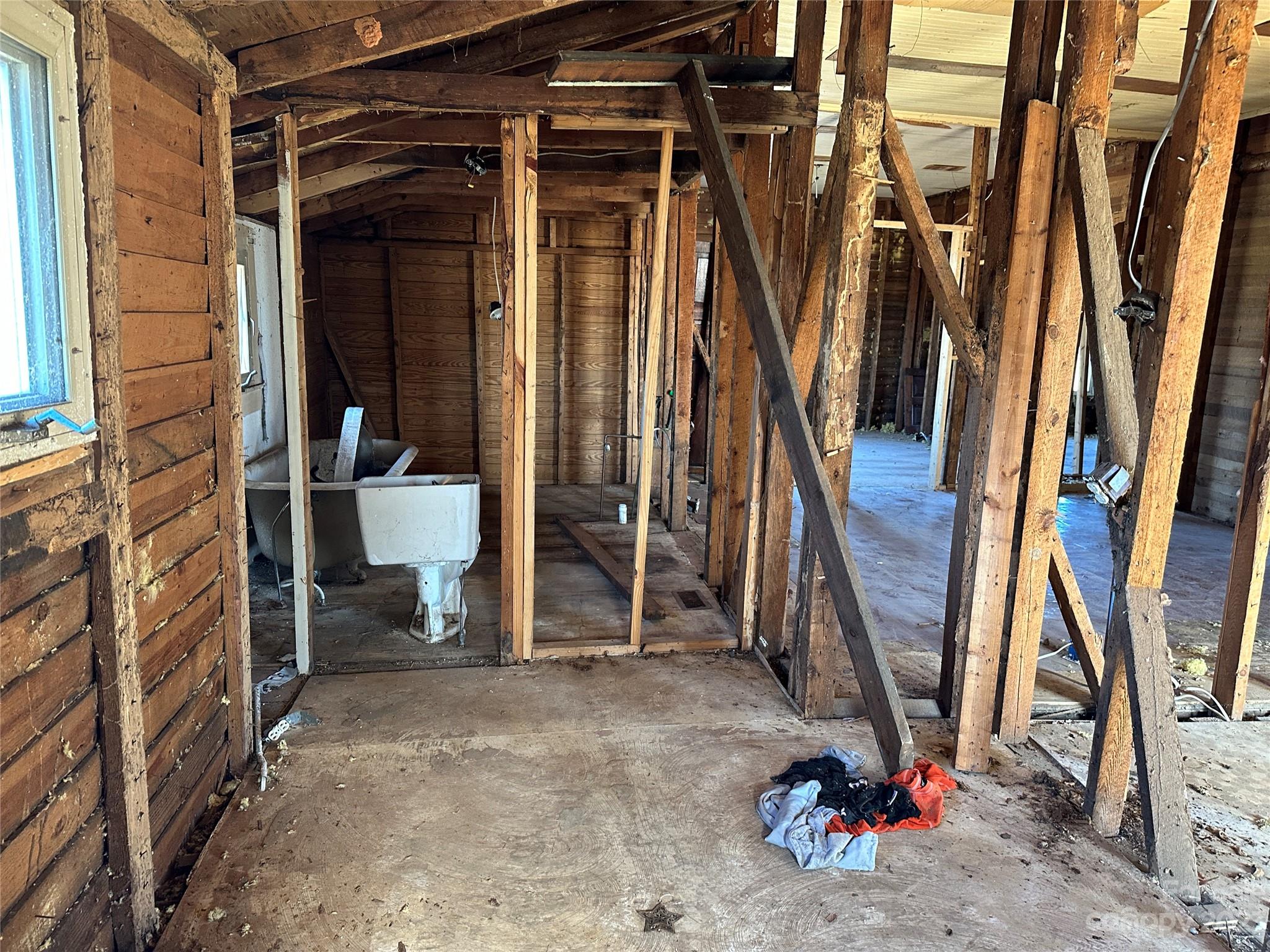 6461 Fallston Road Lawndale, NC 28090 - Photo 8 of 18 a view of an empty room with wooden shelves