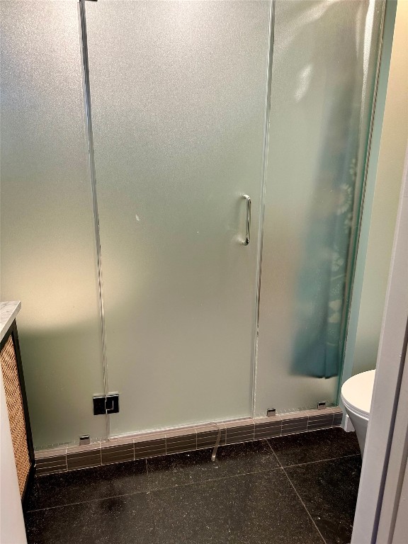 2507 East Side Drive Austin, TX 78704 - Photo 15 of 26 a bathroom with a sink a toilet and a shower