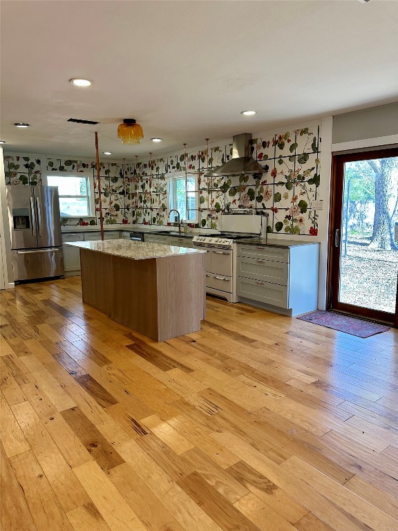 2507 East Side Drive Austin, TX 78704 - Photo 4 of 26 a kitchen with stainless steel appliances kitchen island granite countertop a sink and cabinets