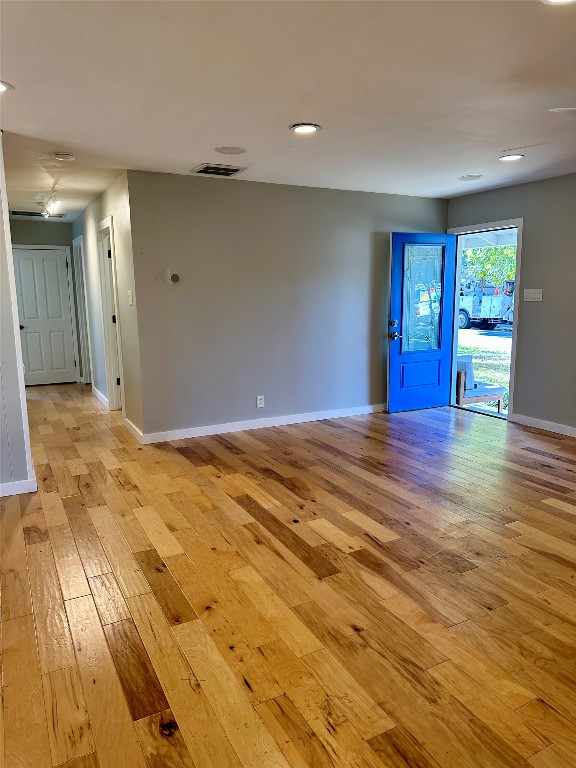 2507 East Side Drive Austin, TX 78704 - Photo 9 of 26 a view of an empty room with window and wooden floor