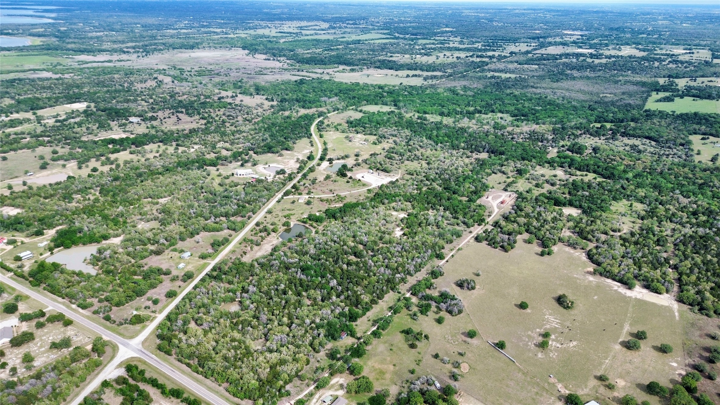 2 Fm 180 Ledbetter, TX 78946 - Photo 11 of 11 an aerial view of residential houses with outdoor space and trees