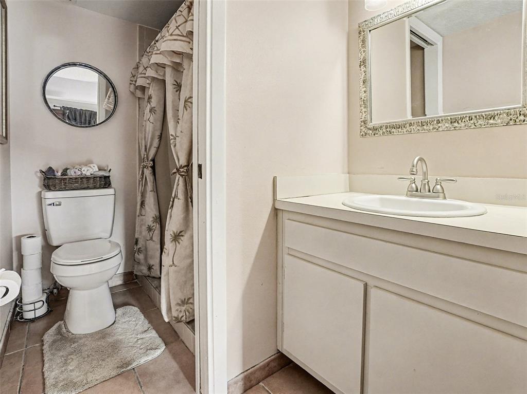 1052 Lotus Cove Court, Unit 733 Altamonte Springs, FL 32714 - Photo 15 of 28 a bathroom with a toilet sink and mirror
